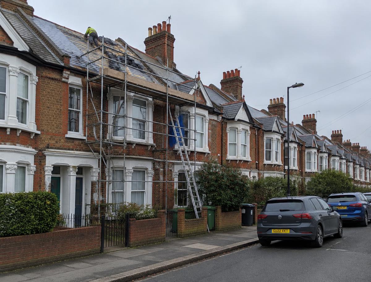 Victorian terraced street with scaffolding for roof works